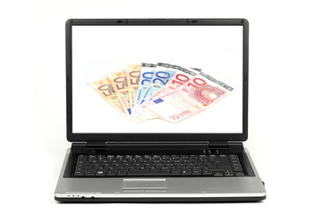 Laptop with euro money on screen isolated on white