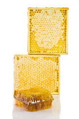 Honeycomb in the wooden frame on the white backrgound