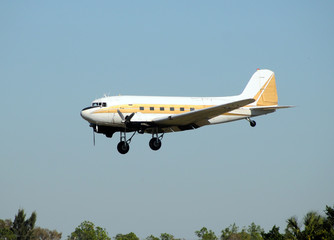 Vintage turboprop airplane approaching for landing