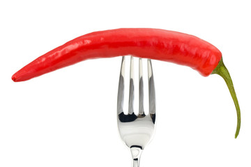 red pepper on a fork isolated on a white background