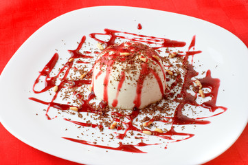 panna cotta (pudding) topped with berry sirup