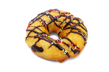 Donut with chocolate icing and colorful sprinkles over white.
