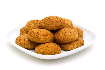 Oats cookies with a poppy on a plate