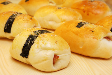 Close up of many seaweed chicken ham buns.