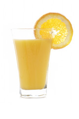 Orange juice reflected on white background. Shallow DOF