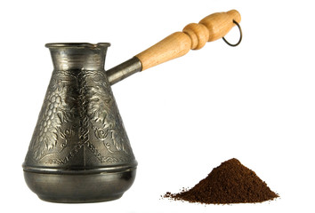 Cezve with coffee powder isoleted on white