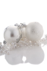 Pretty silver christmas baubles on white background