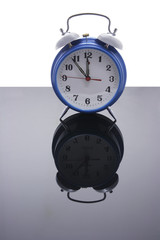 Alarm Clock with Reflection on Black Background