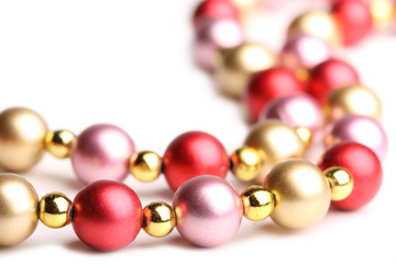 String of beads isolated on white background. Shallow dof