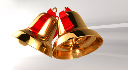Two gold bell with red ribbons on a light background