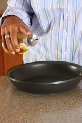 Woman cooking in the kitchen of her home