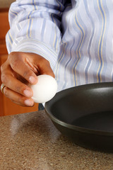 Woman cooking in the kitchen of her home