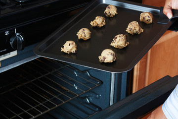 Woman standing in the kitchen of her home