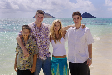 brothers and sister together at the beach in hawaii