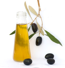 Bottle of olive oil and olive branch