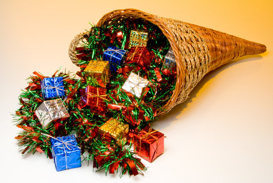 A cornucopia filled with holidat Christmas presents.