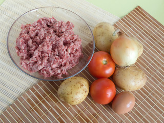 Raw ingridients for meal on cook table