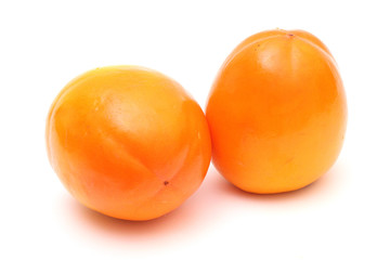 Pair of juicy ripe persimmons