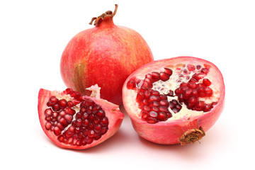 Fresh appetizing pomegranates on white background