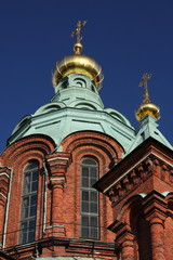 Fototapeta na wymiar Red brick orthodox church in Helsinki, Finland