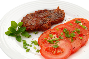 Grilled steak with vegetable salad isolated on white