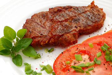Grilled steak with vegetable salad isolated on white