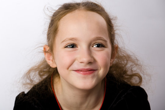 Smiling little girl closeup portrait