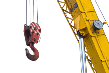 A red truck crane hook a cable