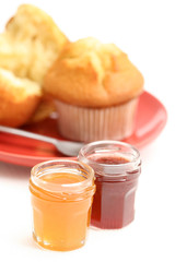 fresh muffins and jars of delicious jam - sweet dessert
