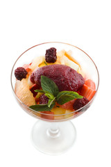 Sweet dessert with ice cream and fruits.