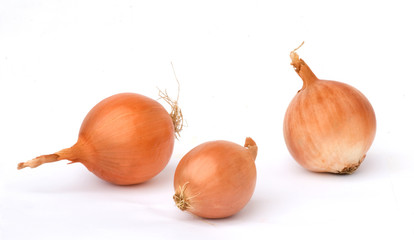 Three onions isolated on white background