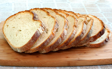 Sliced Italian bread on a cutting board