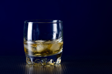 Glass of whiskey and ice