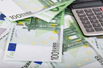 Calculator and euro background. Closeup.