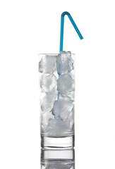 Glass with pure ice, no water with blue straw