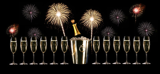 Glasses of champagne with silver ice bucket and fireworks © Sandra Cunningham