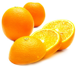 Obraz na płótnie Canvas ripe whole and cut oranges