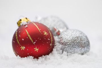 Christmas Baubles In The Snow