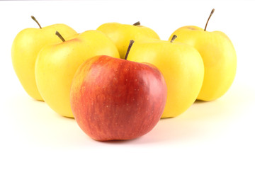 Red apple among yellow ones