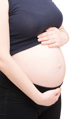 pregnant woman holding her abdomen