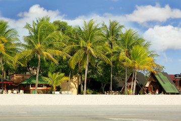 small hotel with sand beach