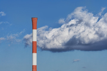 Chimney on a background cloudy sky