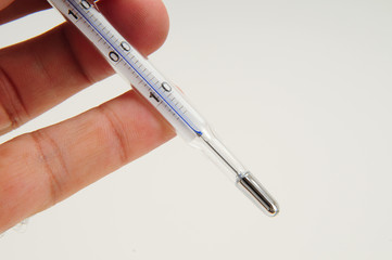 clinical thermometer on hand