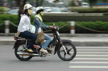 Fototapeta na wymiar Riders Saigon skuter