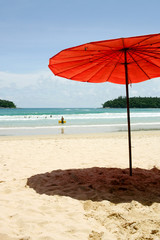 Red umbrella on the beach, Phuket, Thailand