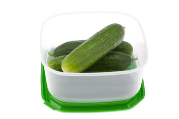 Lunch box with cucumbers.