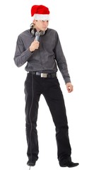 man wearing Santa hat, with  microphone.