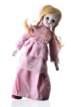 Creepy porcelain doll isolated on white