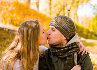 kissing couple in autumn park