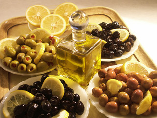 close up shot of  black and green olives